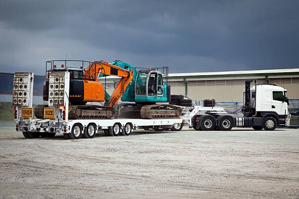 cara aman pindahkan alat berat